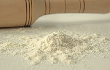 Baking flour and wooden rolling pin