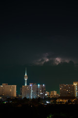 Fototapeta na wymiar Night city, thunderstorm, lightning. Pattaya