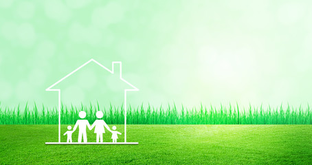 Happy Family Concept : Family and home icons on green grass meadow field with green natural and sunlight in background.