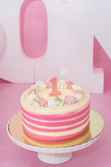 baking pink birthday cake for baby girl 1 year