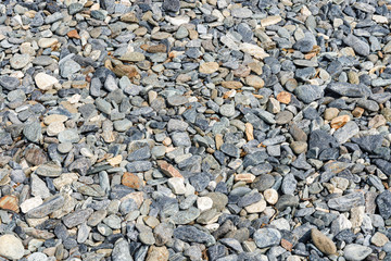Black small road stone background, dark gravel pebbles stone texture, granite,marble