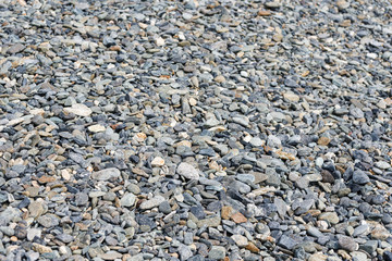 Black small road stone background, dark gravel pebbles stone texture, granite,marble