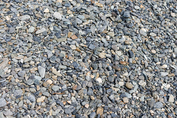 Black small road stone background, dark gravel pebbles stone texture, granite,marble