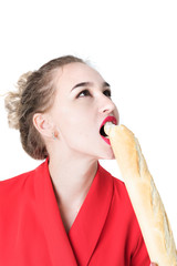 portrait of a young, beautiful, slender girl who eats a baguette.