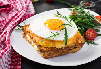 Breakfast. French cuisine. Croque madame sandwich close up on the table.