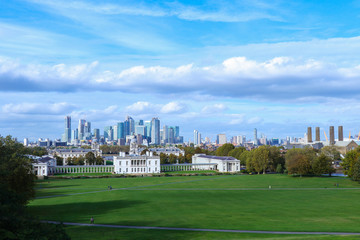 Fototapeta na wymiar Panaroma view of National Maritime Museum in Greenwich with skyscrapers at the background and green parkin the foreground.