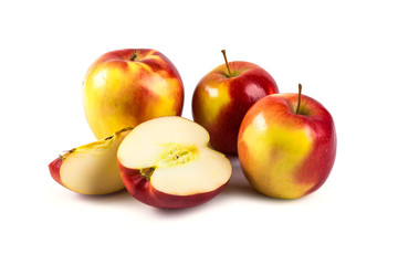 Fresh red-yellow apples with sliced pieces isolated on white background