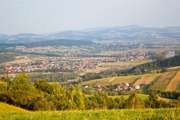 Fototapeta na wymiar Village Barcice and Stary Sącz Town. View from village Wola Krogulecka, Poland.