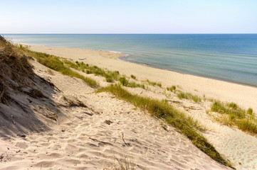 High sand dunes. Picturesque sea shores. Curonian Spit on the Baltic Sea.