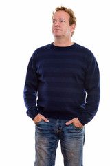 Fototapeta premium Studio shot of mature man with curly blond hair isolated against white background