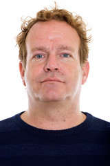 Studio shot of mature man with curly blond hair isolated against white background