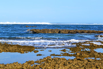 Fototapeta na wymiar Beautiful Ocean Wave at the Rock Beach with Sky. Landscape Nature - Image