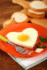 Fototapeta premium Fried Egg Sunny Side Up in Heart Shape