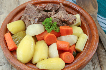 dish of pot au feu with beef on a table