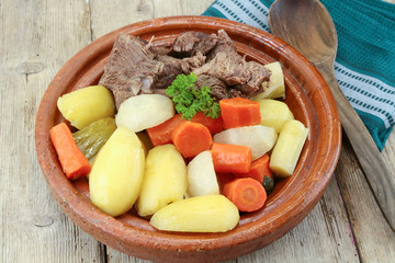 dish of pot au feu with beef on a table