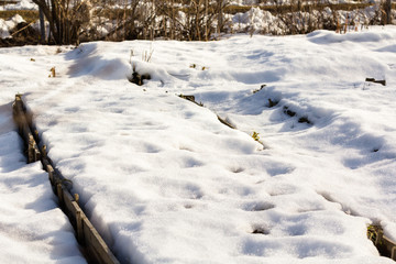 Fototapeta na wymiar Snow thawed beds