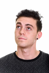Fototapeta premium Studio shot of young handsome man isolated against white background