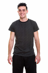 Fototapeta premium Studio shot of young handsome man isolated against white background