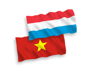 Flags of Vietnam and Luxembourg on a white background