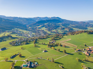 Aerial view of Swiss countryside. Pre-alpine landscape in Switzerland. Peaceful farmland in rural area.