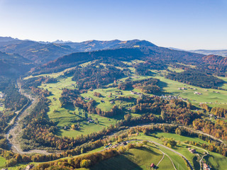 Aerial view of Swiss countryside. Pre-alpine landscape in Switzerland. Peaceful farmland in rural area.