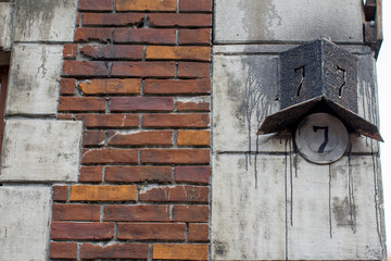 House number seven on an old building.