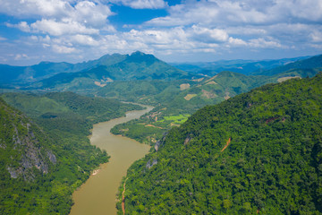 Fototapeta na wymiar Aerial view of tropical rainforest. North Laos. Southeast Asia. Photo made by drone from above. Bird eye view.