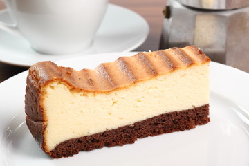 Cheesecake and coffee cup. Macro.