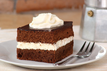 Chocolate Sponge Cake filled with whipped cream. Cream Pie.