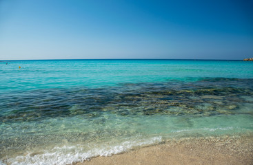 The most famous beach of Cyprus with crystal clear water. Nissi Beach.