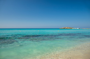 The most famous beach of Cyprus with crystal clear water. Nissi Beach.