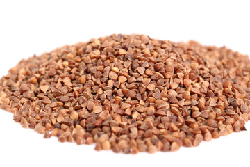 Heap of buckwheat seeds. Isolated on white background.