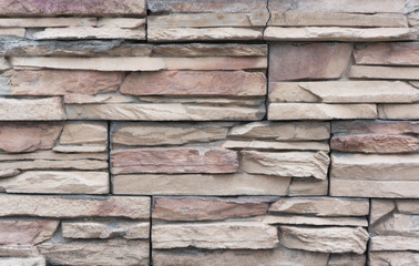 Beautiful wall made of tiles imitating natural stone. Finishing material - tile "stone"