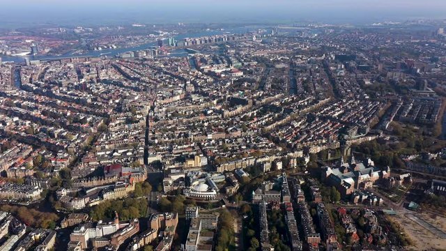 Aerial of the inner city of Amsterdam, with its canals and old mansions. Highlights in the center Prinsengracht, Herengracht, Keizersgracht and in the background the IJ and the Central Station.
