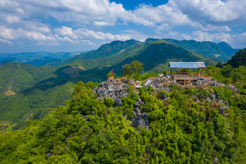 Fototapeta na wymiar Aerial view of mountains in Nong Khiaw. North Laos. Southeast Asia. Photo made by drone from above. Bird eye view.