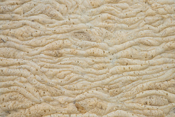 Background of yellow foam on the water