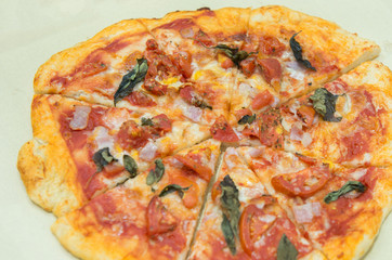 Homemade pizza with tomatoes, mozzarella and basil