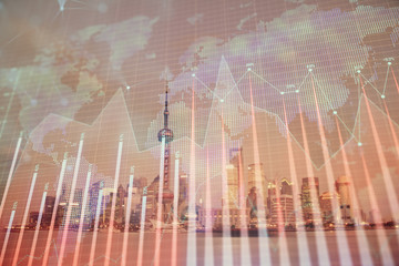 Forex chart on cityscape with tall buildings background multi exposure. Financial research concept.