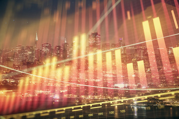 Financial graph on night city scape with tall buildings background double exposure. Analysis concept.