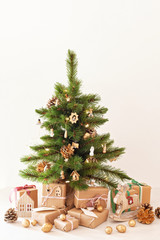 Decorated christmas tree with wrapped gifts. Christmas and new year celebration concept
