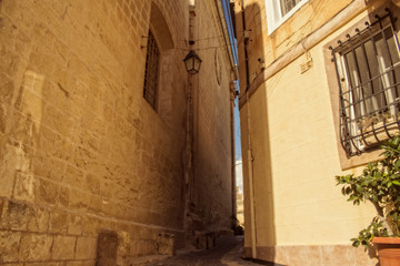 Fototapeta na wymiar Old Narrow Street in Attard, Malta