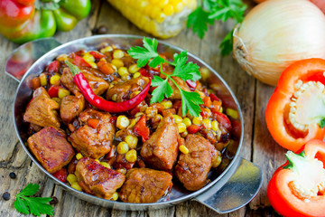 Meat stew with vegetables corn, pepper, onion, carrot in soy sauce gravy