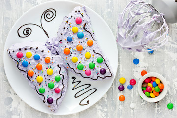 Butterfly cake - delicious homemade cake shaped colorful butterfly decorated with cream, chocolate...