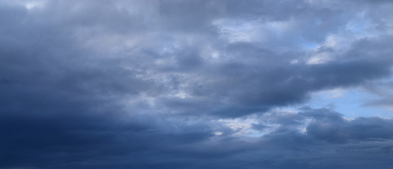 Heavy rain clouds. Photography, atmospheric phenomena, panoramic image of the autumn sky.