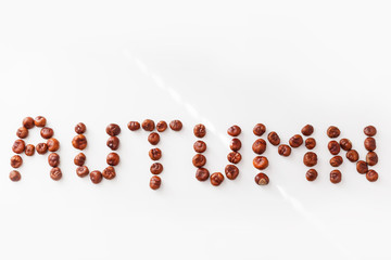Word autumn made of chestnuts