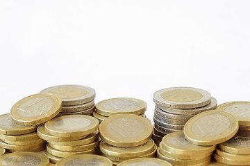 Piles of euro coins on white background