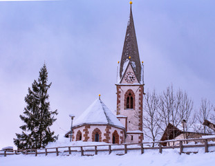 Fototapeta na wymiar Snow covered church in winter; little village Hafling in South Tyrol 