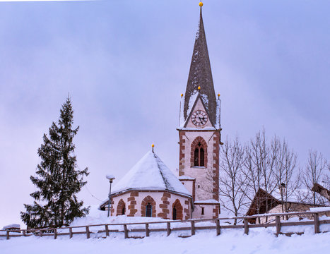 Snow covered church in winter; little village Hafling in South Tyrol 