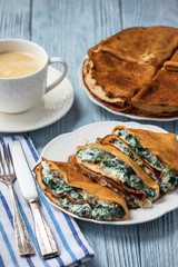 Spinach and feta cheese filled crepes. 