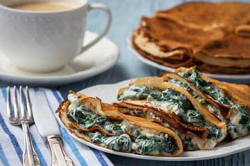 Spinach and feta cheese filled crepes. 